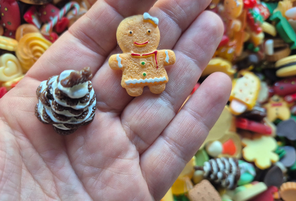 Gingerbread man and woman Christmas tree and candy mix