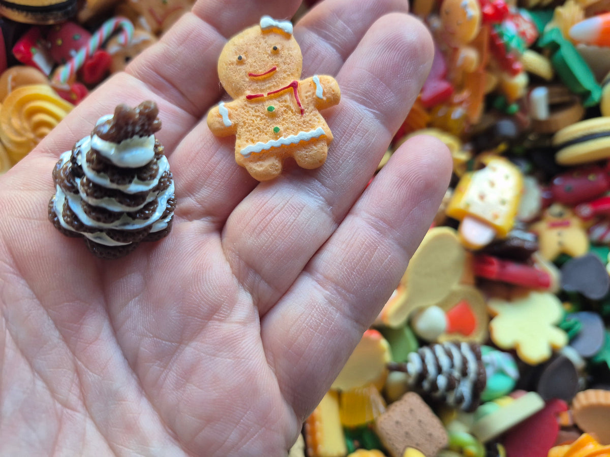 Gingerbread man and woman Christmas tree and candy mix